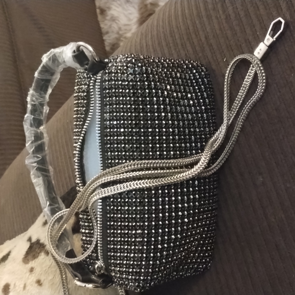 Small black handbag with gun metal strap